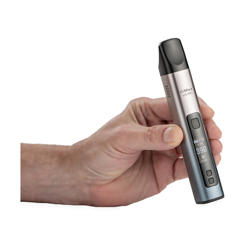 Lightly Used XMAX V3 Pro Vaporizer Silver in hand View