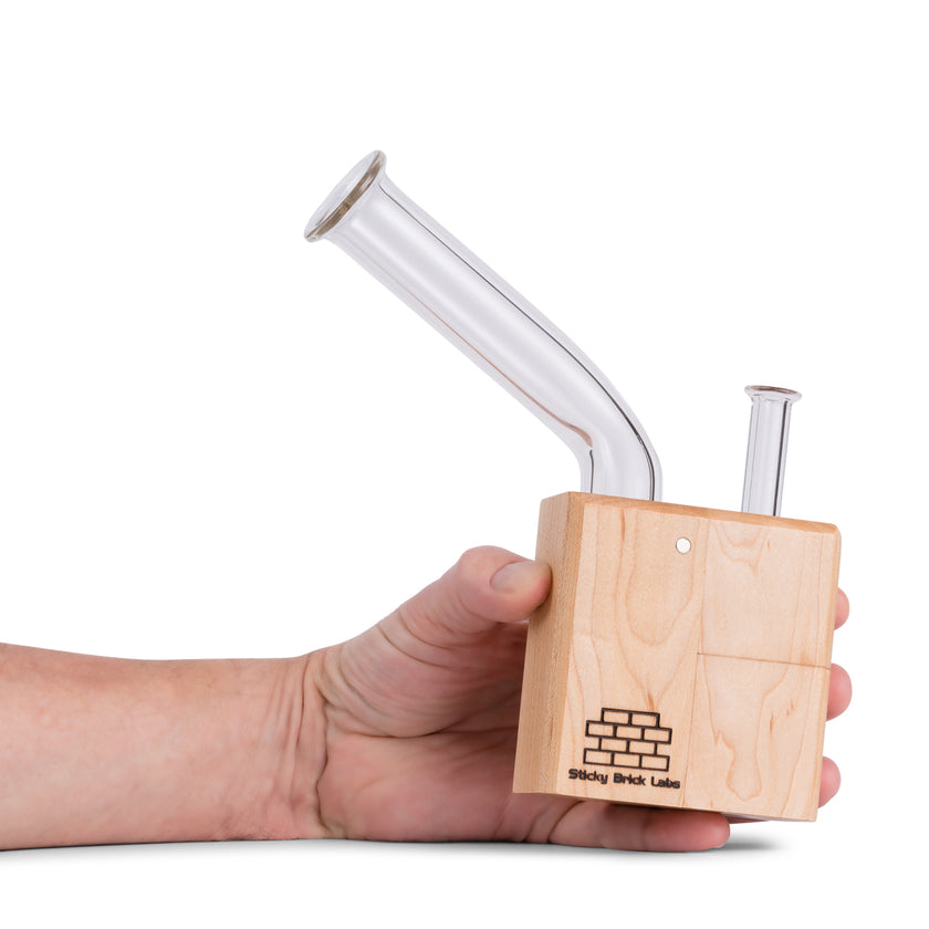 Sticky Brick OG Vaporizer Maple in hand